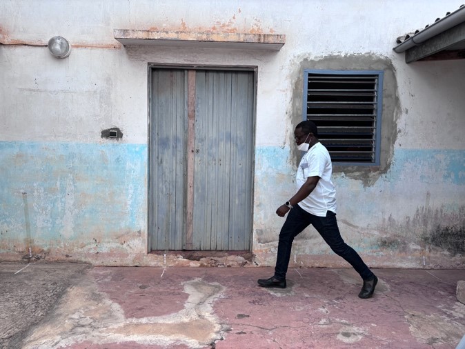 Dr Fiogbe testing a 6-minute walk test setup in Togo